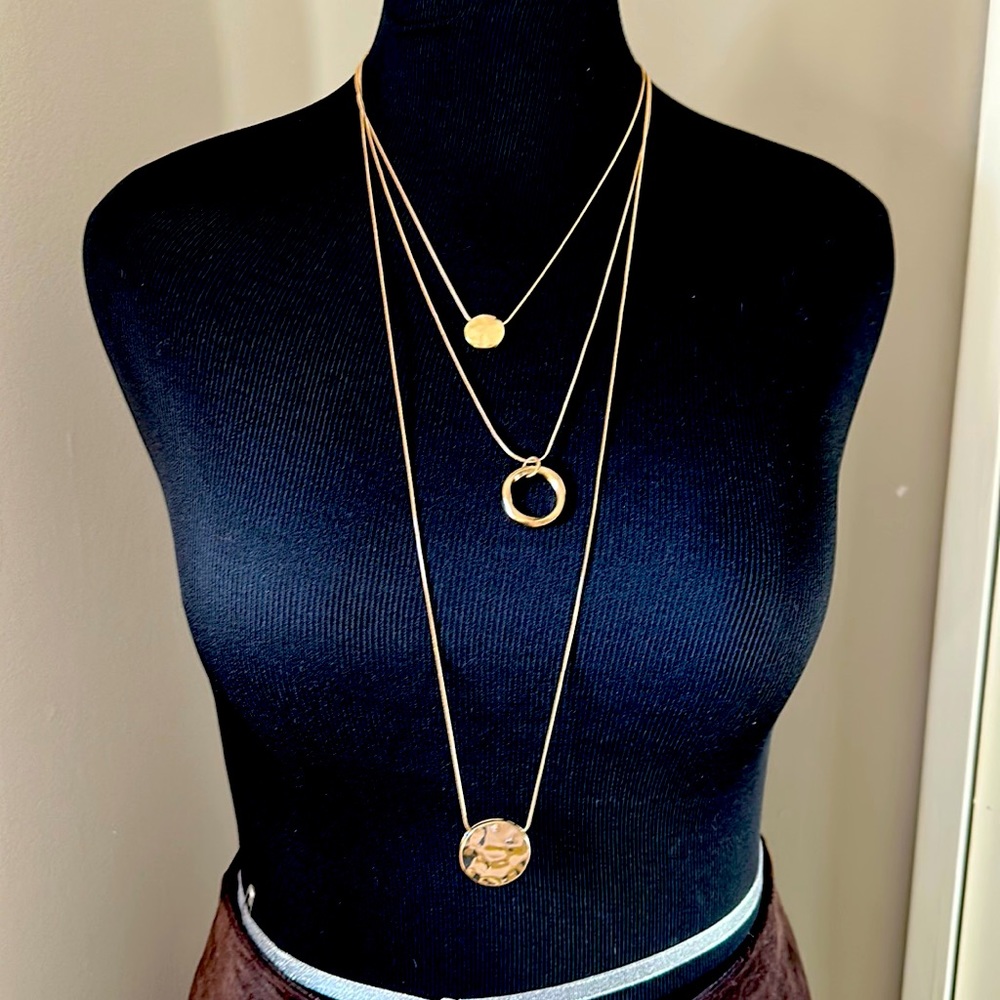Gold chain necklace. 3 chains can be added and removed.